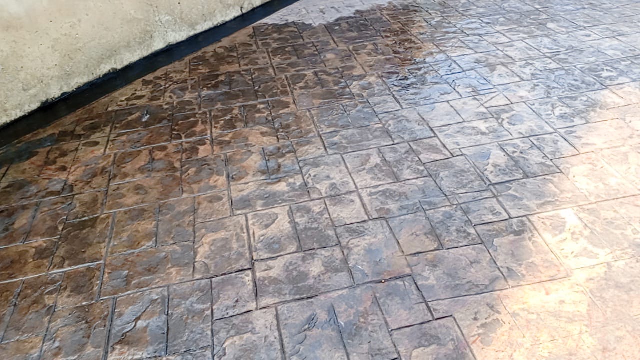 Cobblestone stamped concrete surface in warm brown release tones
